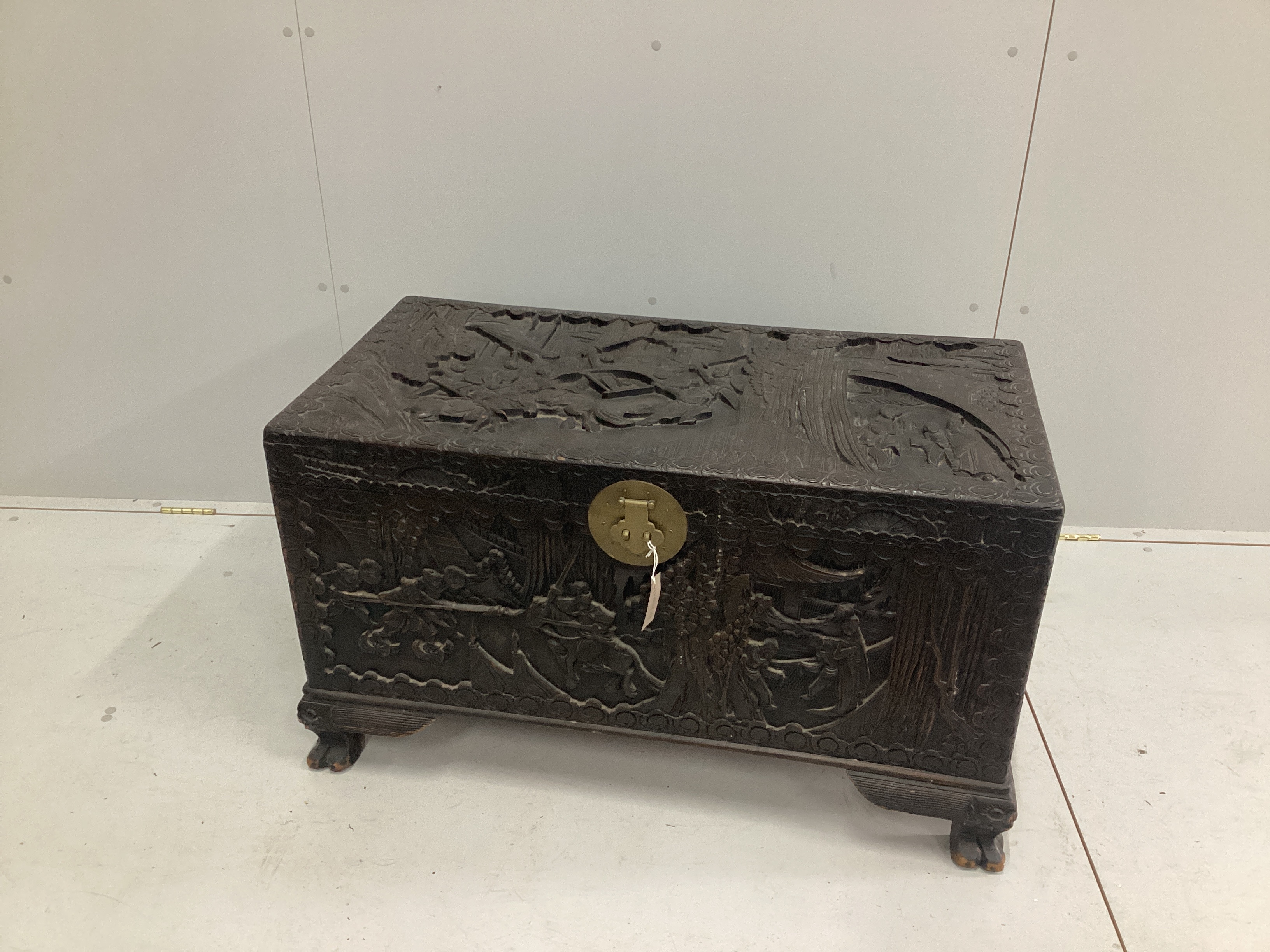 A late 19th century Cantonese carved camphorwood chest, width 100cm, Please note this lot attracts an additional import tax of 5% on the hammer price